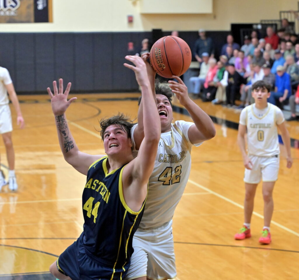 Saints' Javen Diaz battles with Justin Strausbaugh for a rebound. (PhilMarPhoto)